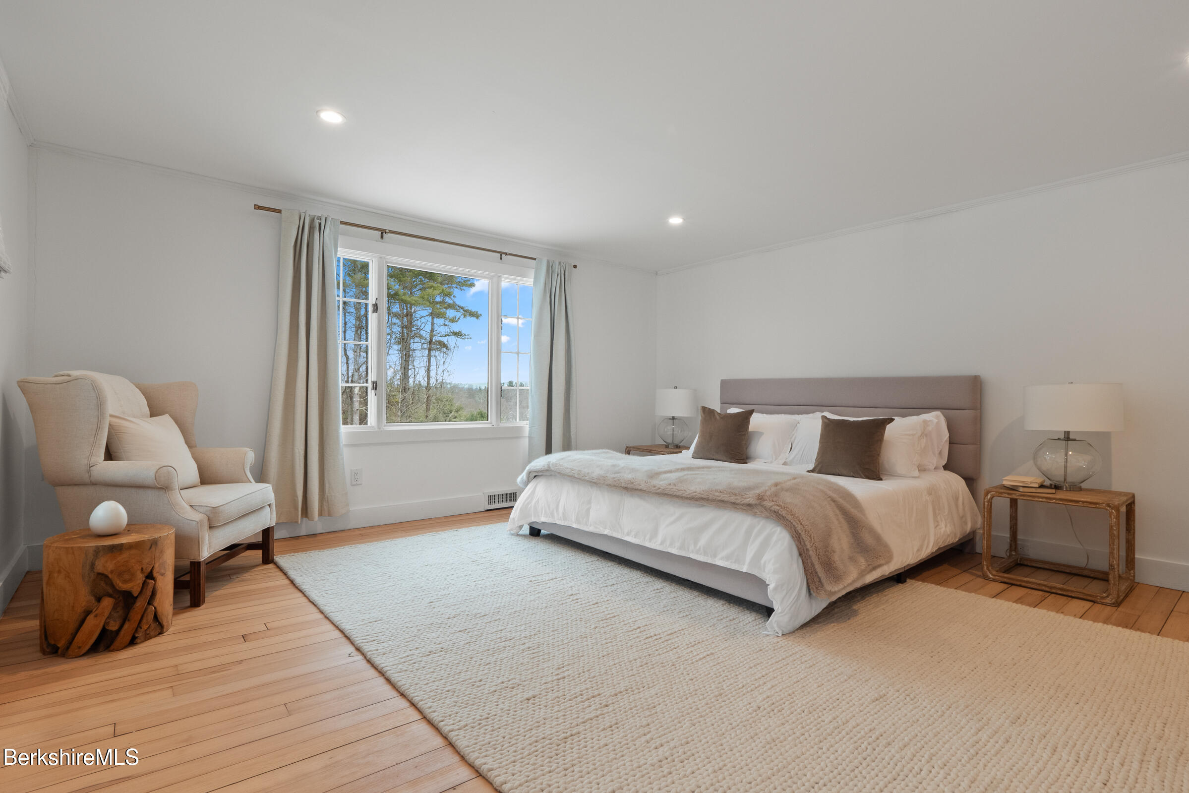 14 Pinecrest Cross Road Egremont, MA 01230 - Photo 19 of 40 a spacious bedroom with a bed and glass window