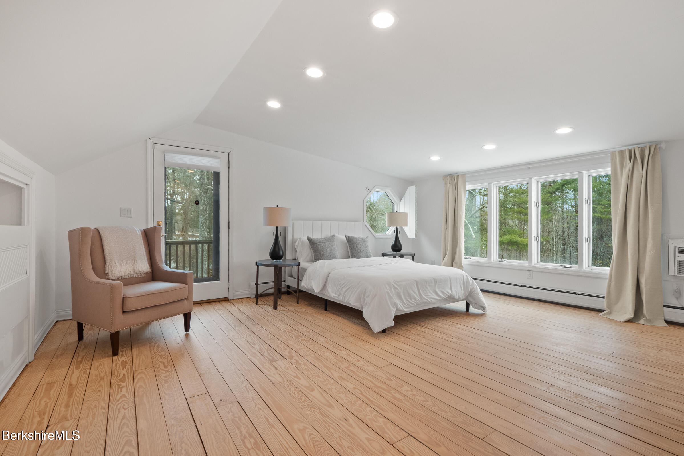 14 Pinecrest Cross Road Egremont, MA 01230 - Photo 28 of 40 a bedroom with a bed and a wooden floor