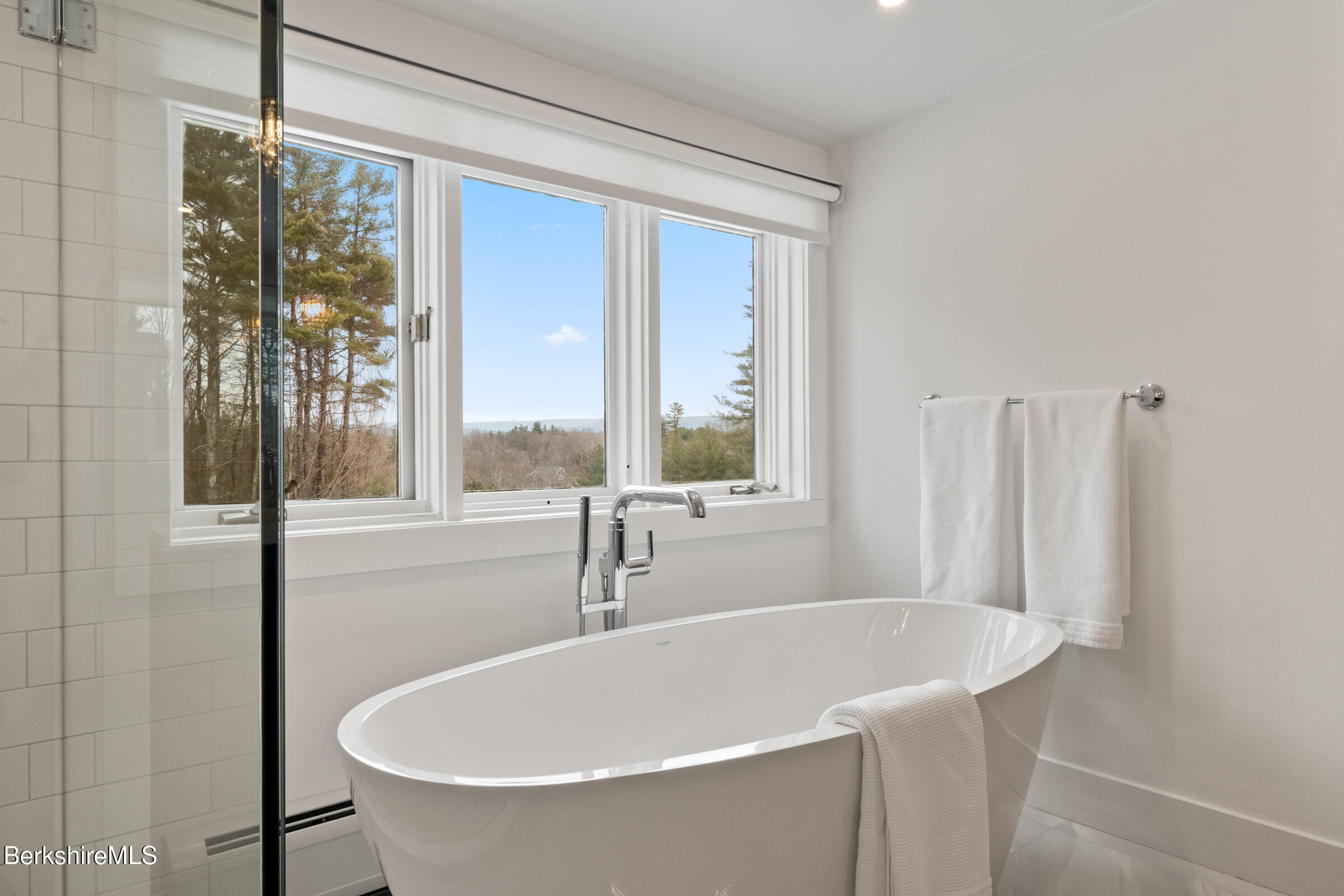 14 Pinecrest Cross Road Egremont, MA 01230 - Photo 30 of 40 a white bath tub sitting next to a window