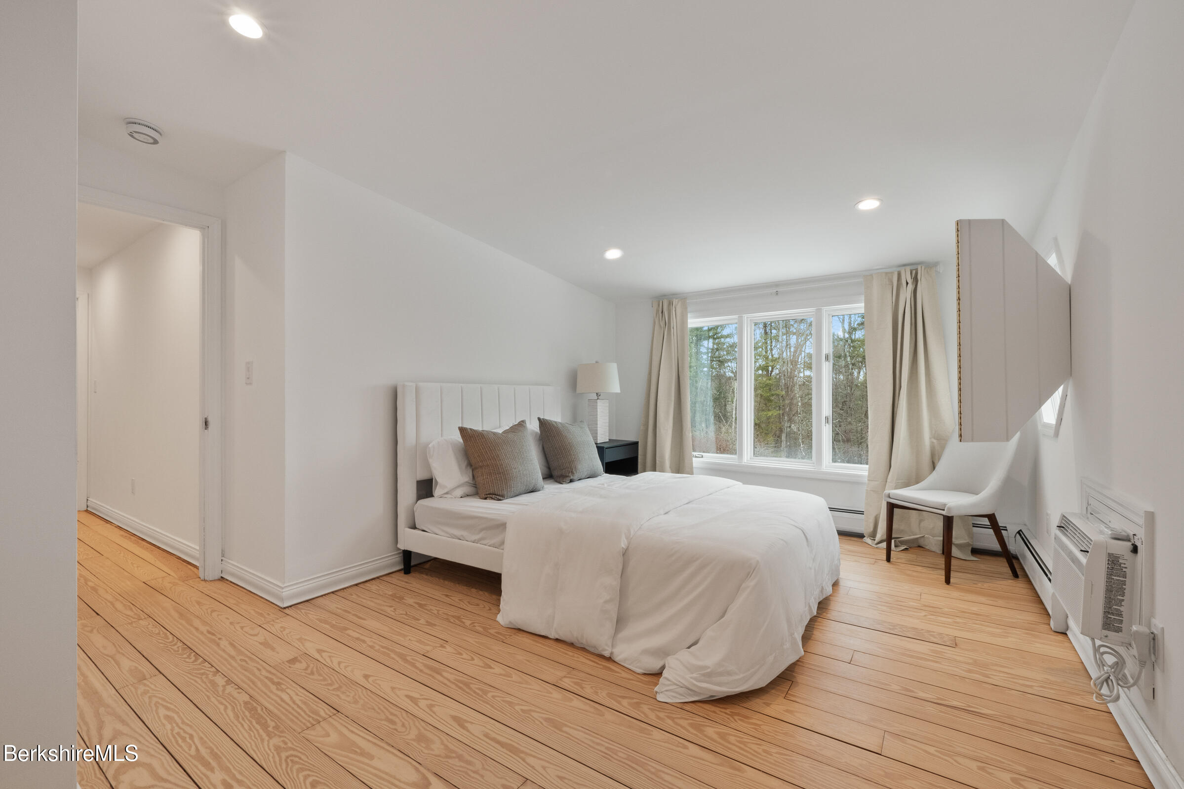 14 Pinecrest Cross Road Egremont, MA 01230 - Photo 32 of 40 a bedroom with a bed and wooden floor