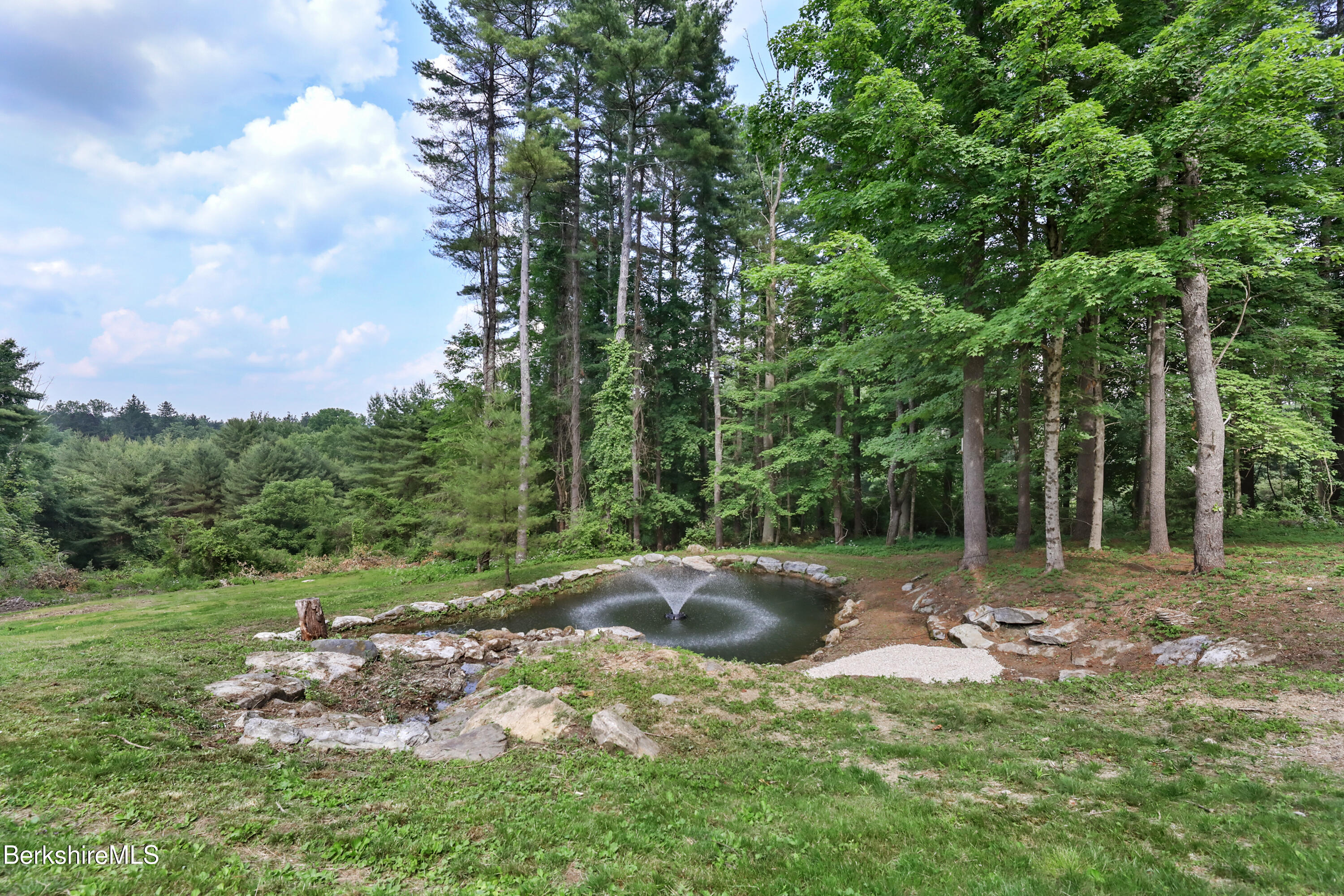 14 Pinecrest Cross Road Egremont, MA 01230 - Photo 39 of 40 a backyard of a house with lots of green space