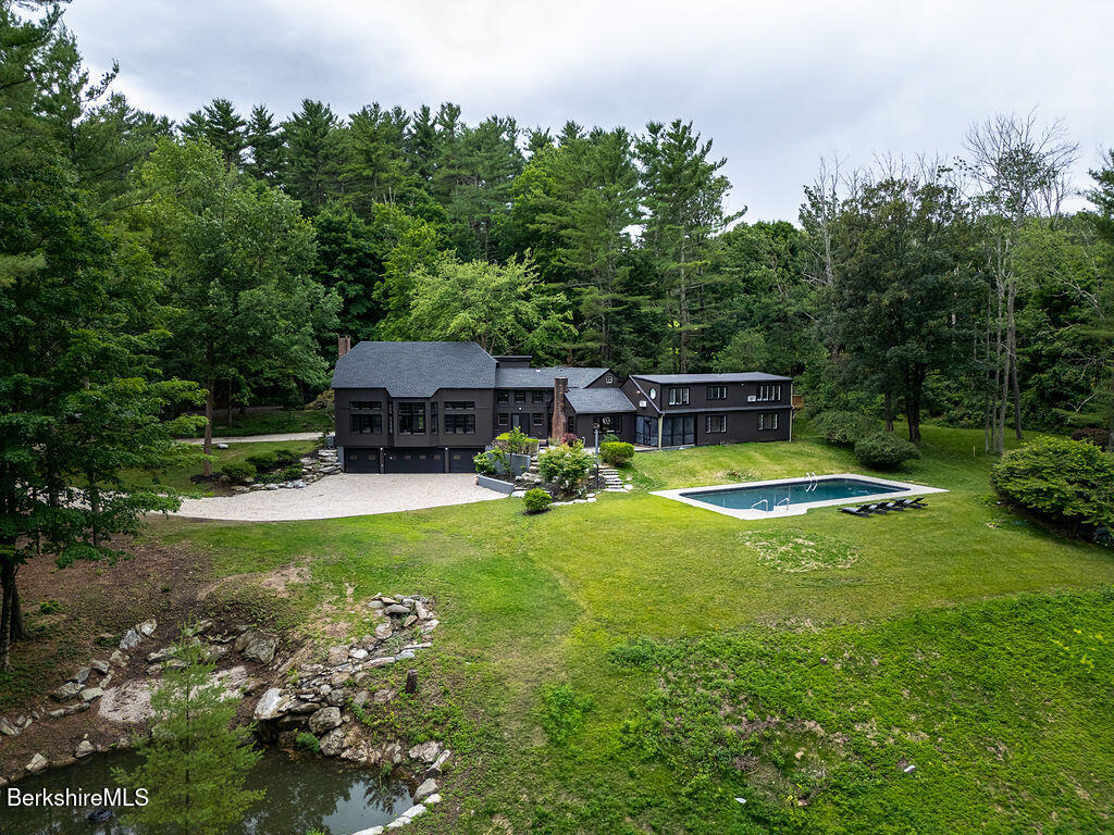 14 Pinecrest Cross Road Egremont, MA 01230 - Photo 40 of 40 a view of a house with swimming pool and a yard