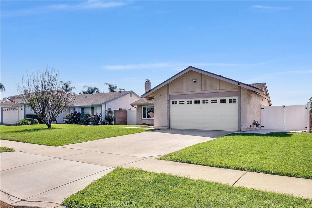 9315 Devon Street Rancho Cucamonga, CA 91730 - Photo 3 of 39 a large house with a big yard and large trees