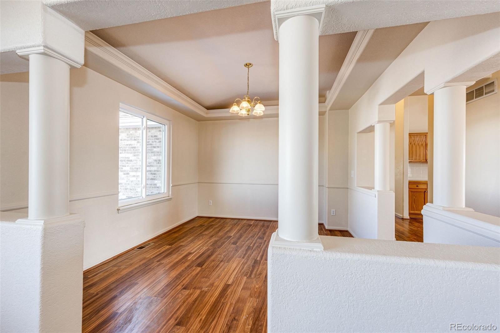 5672 Columbine Ridge Road Elizabeth, CO 80107 - Photo 16 of 50 a view of a room with wooden floor and windows
