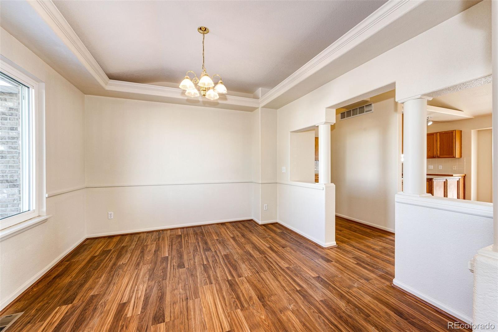 5672 Columbine Ridge Road Elizabeth, CO 80107 - Photo 18 of 50 a view of a room with wooden floor and white walls