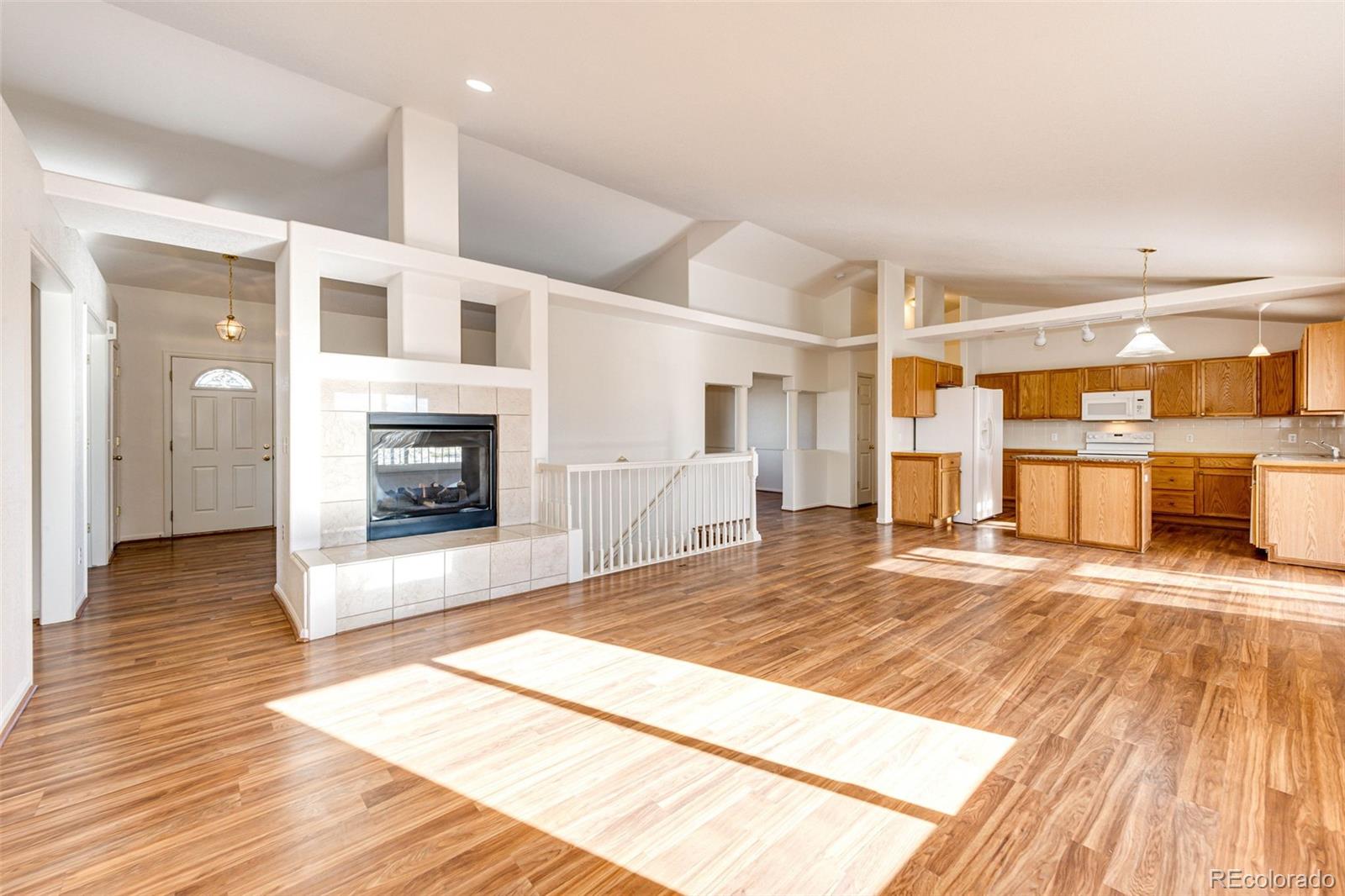 5672 Columbine Ridge Road Elizabeth, CO 80107 - Photo 24 of 50 a view of a livingroom with a fireplace and wooden floor