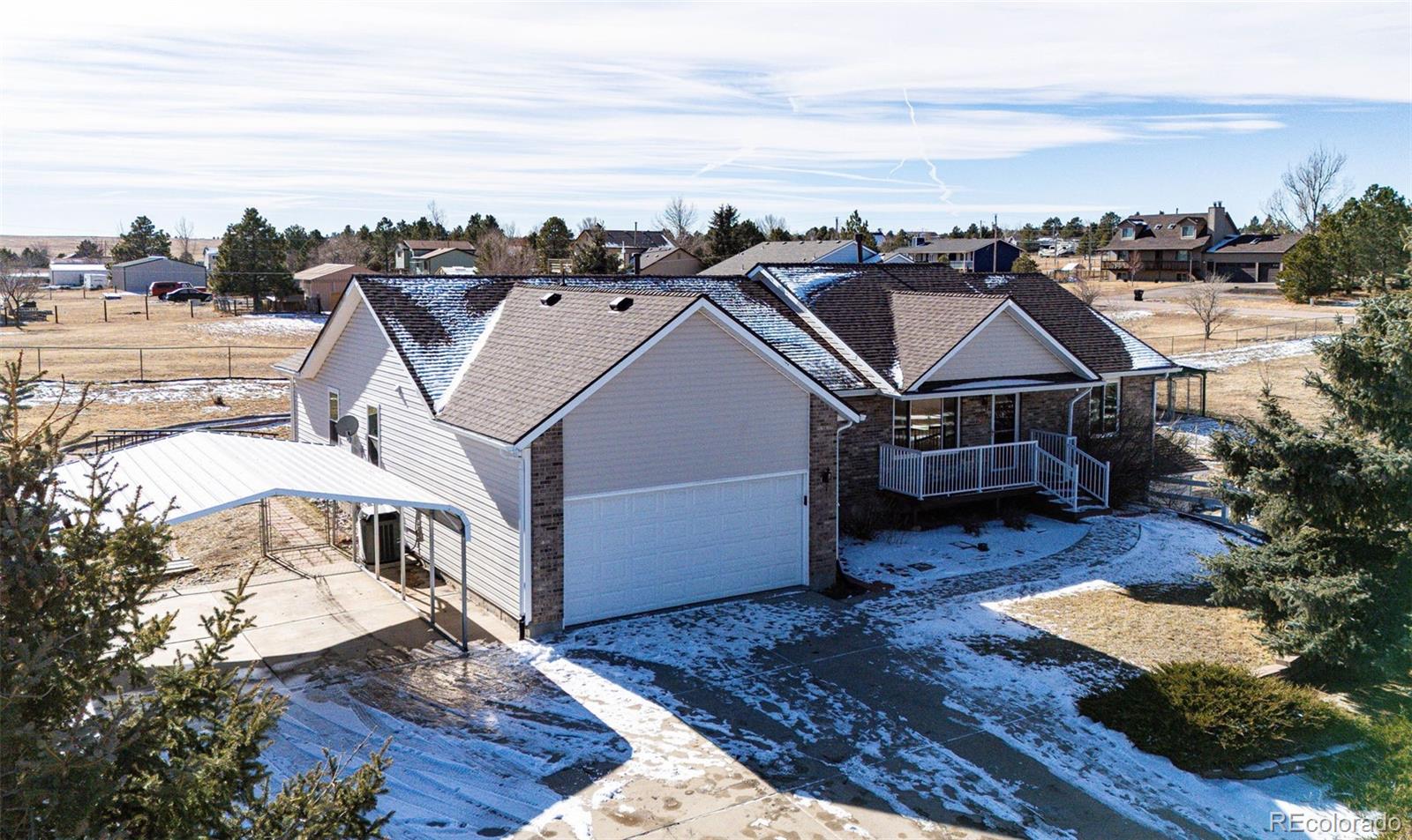 5672 Columbine Ridge Road Elizabeth, CO 80107 - Photo 3 of 50 a view of a house with roof deck