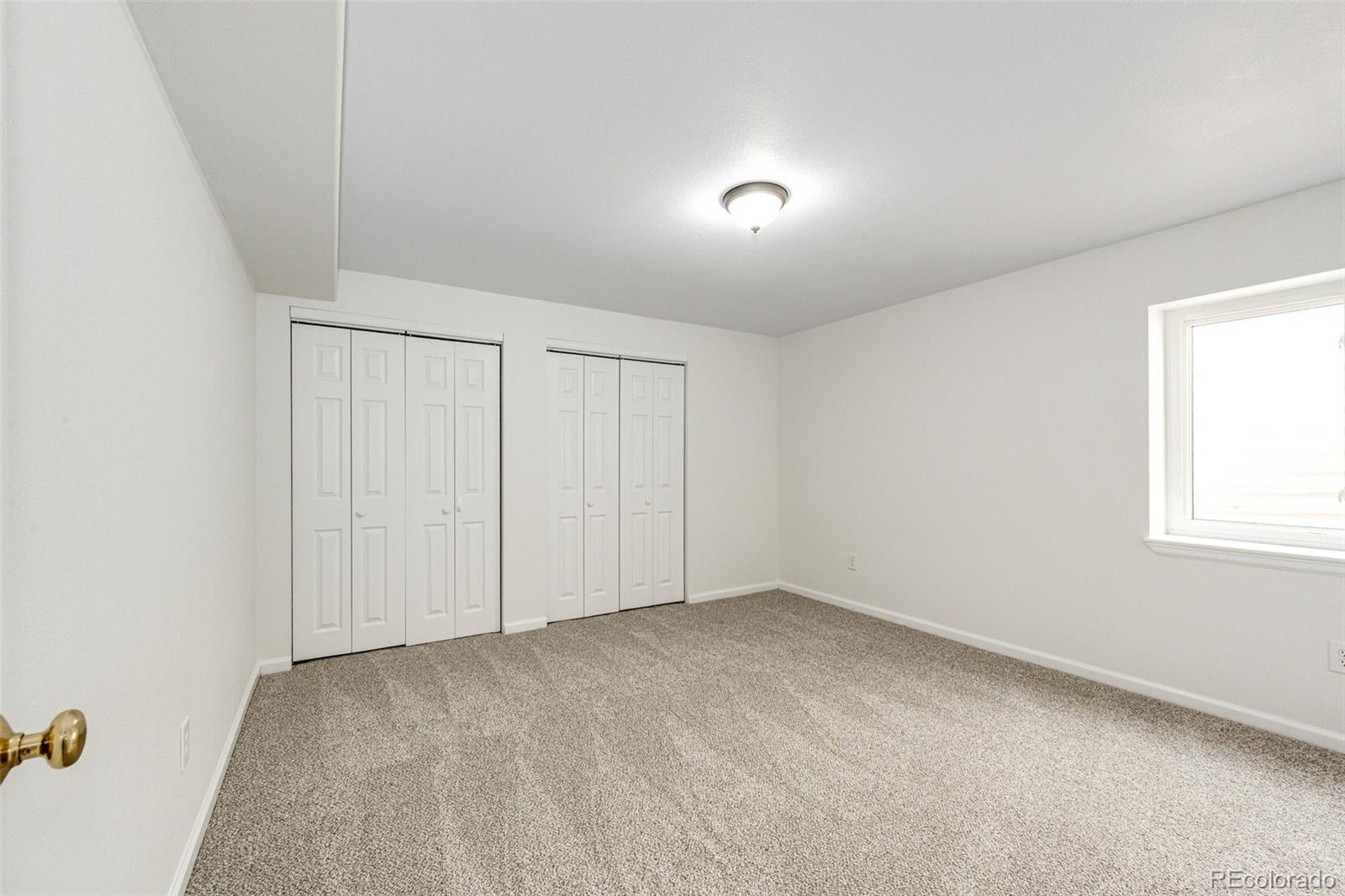 5672 Columbine Ridge Road Elizabeth, CO 80107 - Photo 36 of 50 an empty room with windows