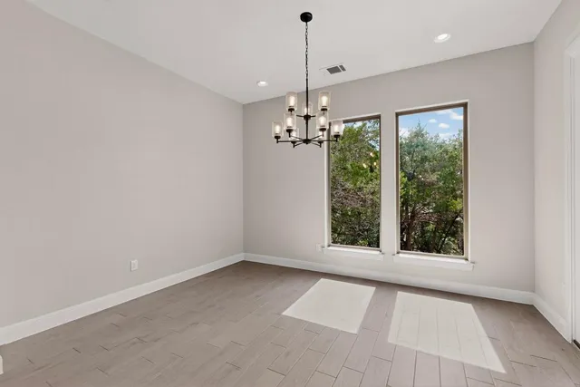 a kitchen with granite countertop a sink a counter top space and living room view