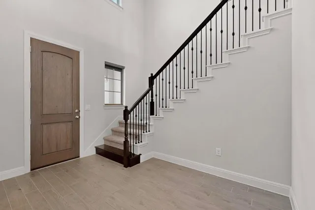 a view of entryway with wooden floor