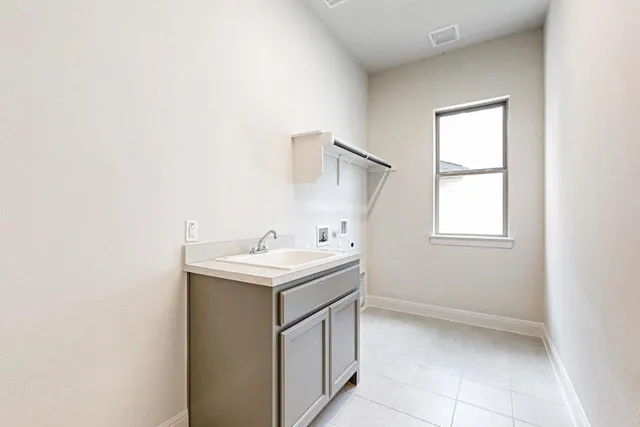 a bathroom with a sink toilet vanity and bathtub