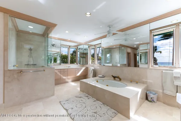 a bathroom with a double vanity sink mirror and shower