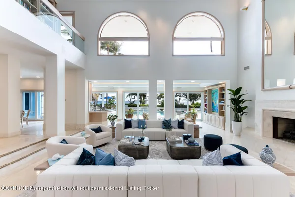 a lobby with furniture and a potted plant