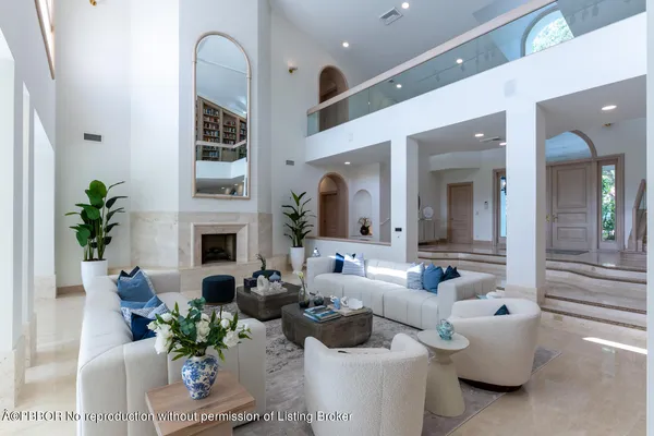 a kitchen with stainless steel appliances granite countertop a sink refrigerator and microwave