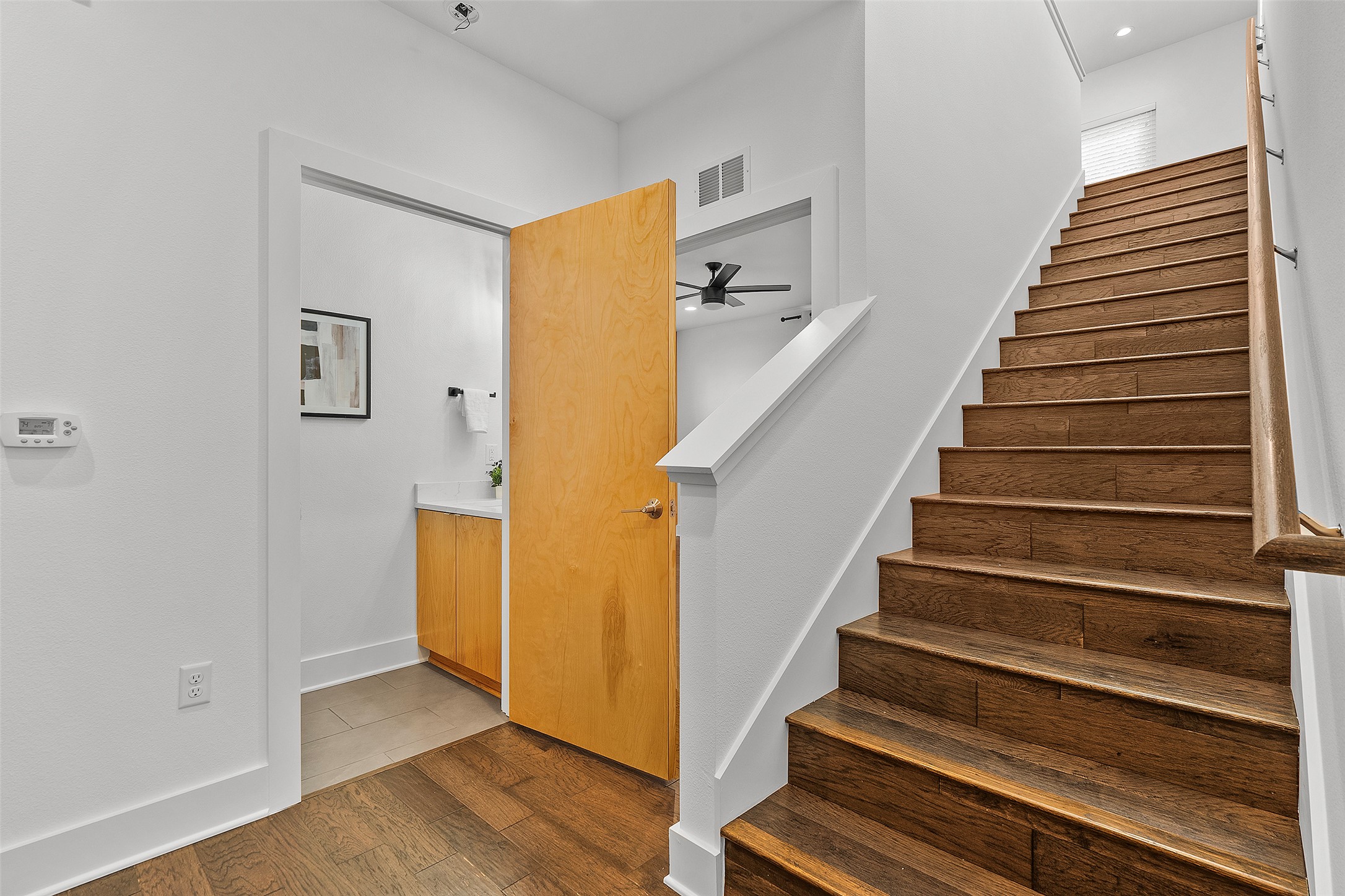 7813 Mullen Drive, Unit B Austin, TX 78757 - Photo 17 of 36 a view of entryway and hall with wooden floor