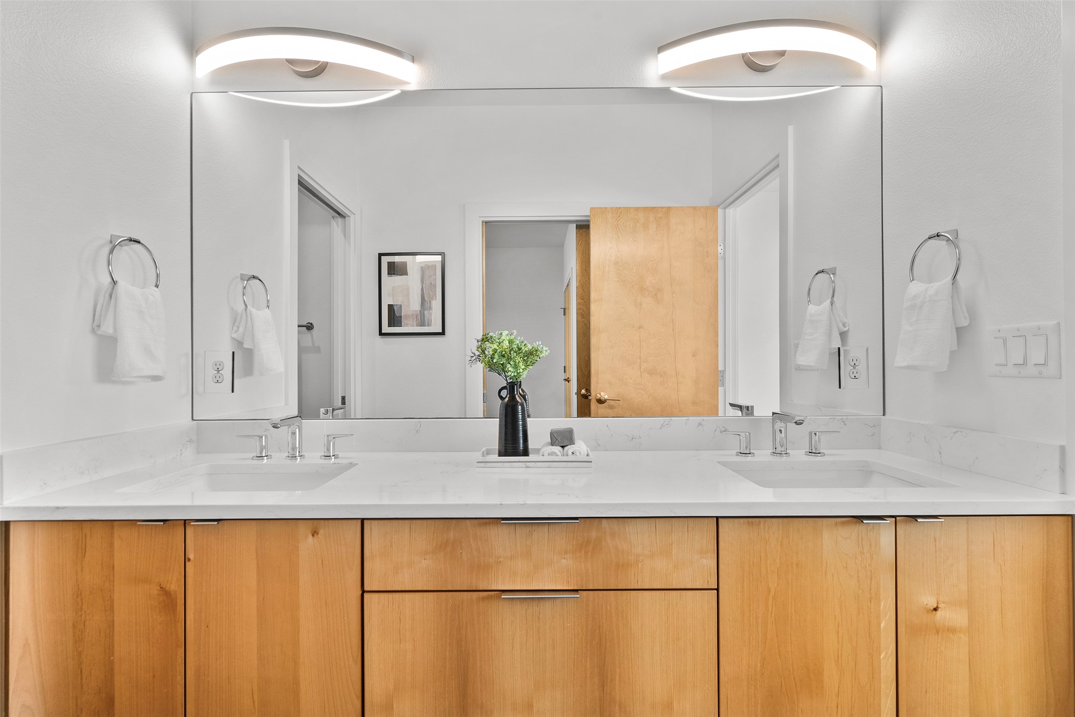 7813 Mullen Drive, Unit B Austin, TX 78757 - Photo 25 of 36 a bathroom with a granite countertop sink and a mirror