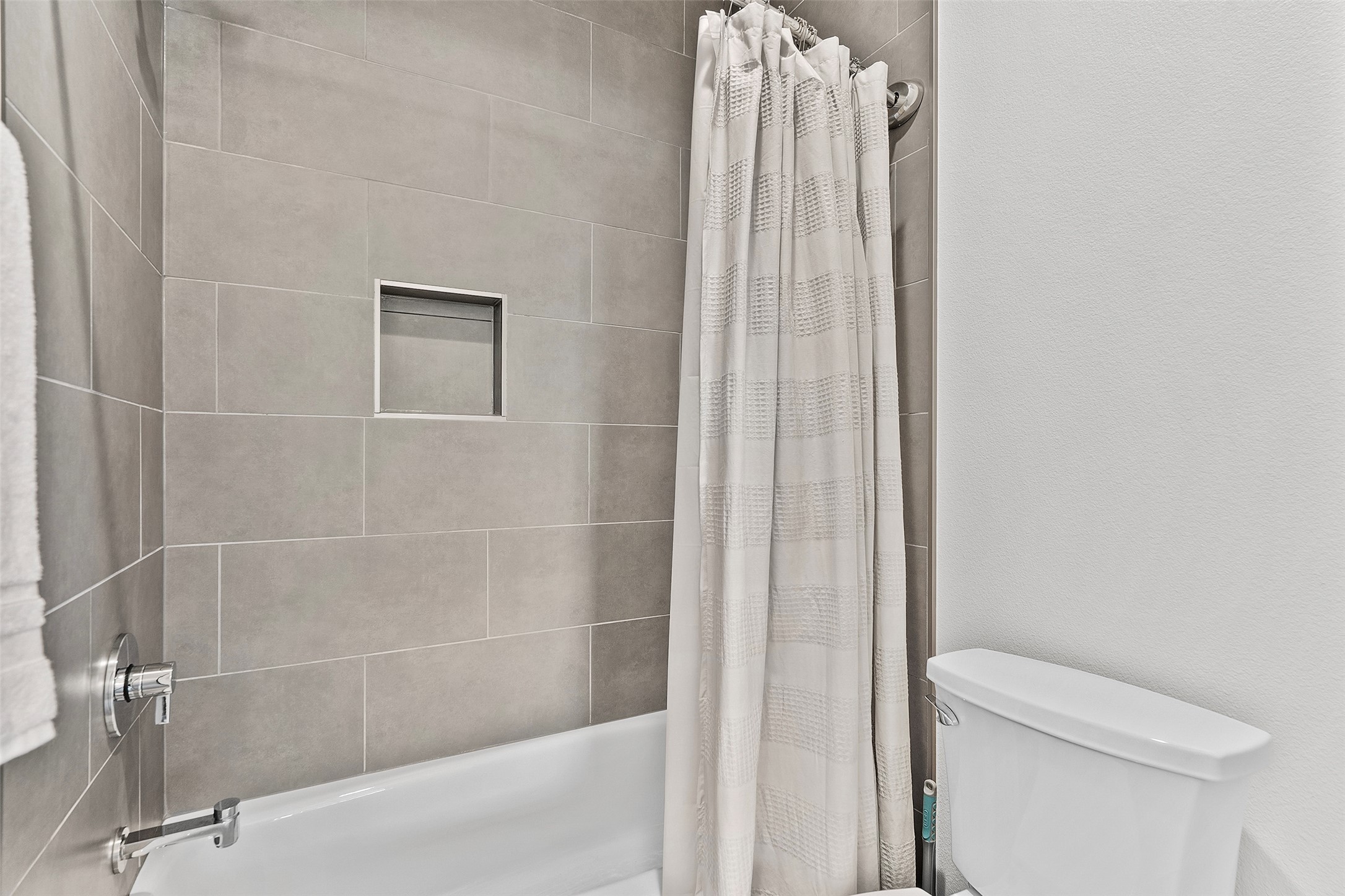 7813 Mullen Drive, Unit B Austin, TX 78757 - Photo 29 of 36 a bathroom with a shower and a toilet
