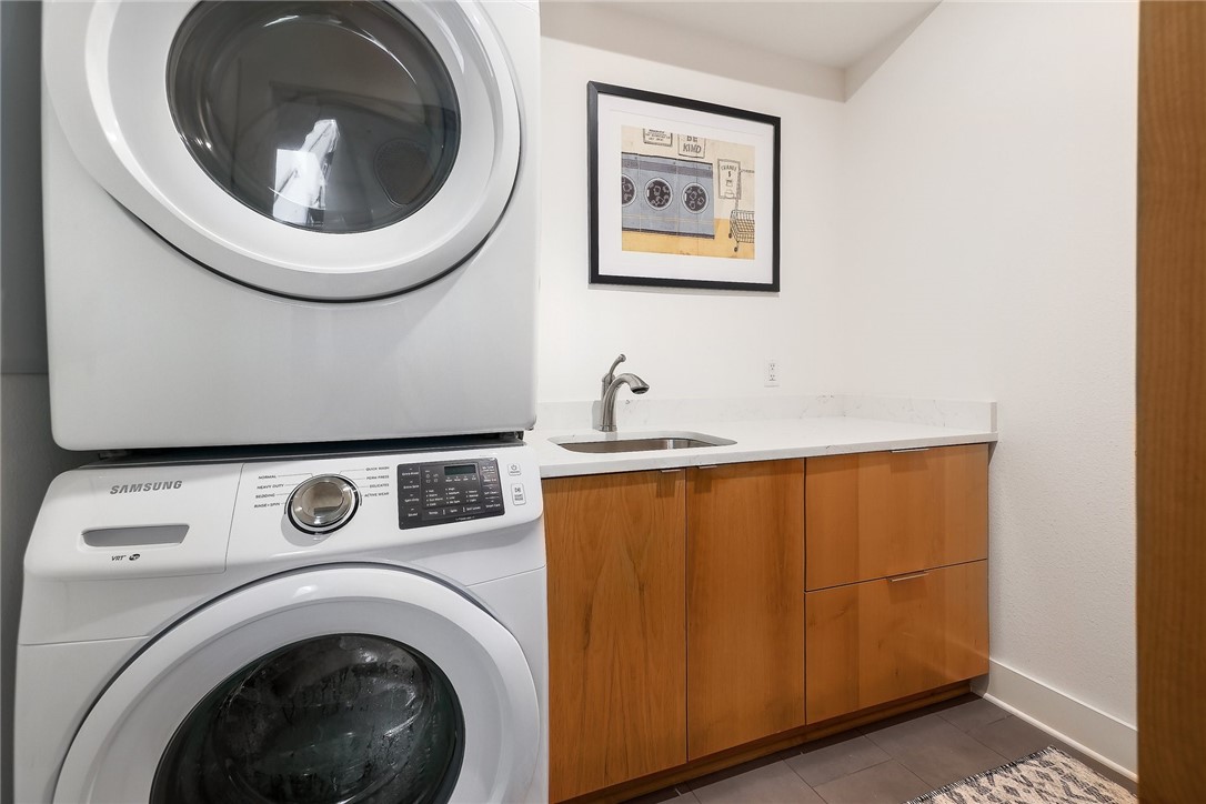 7813 Mullen Drive, Unit B Austin, TX 78757 - Photo 30 of 36 a utility room with dryer and washer