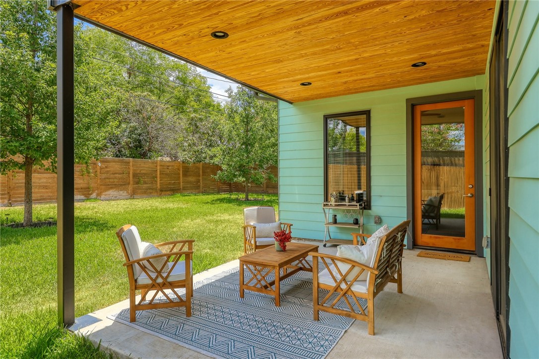 7813 Mullen Drive, Unit B Austin, TX 78757 - Photo 32 of 36 a backyard of a house with outdoor seating