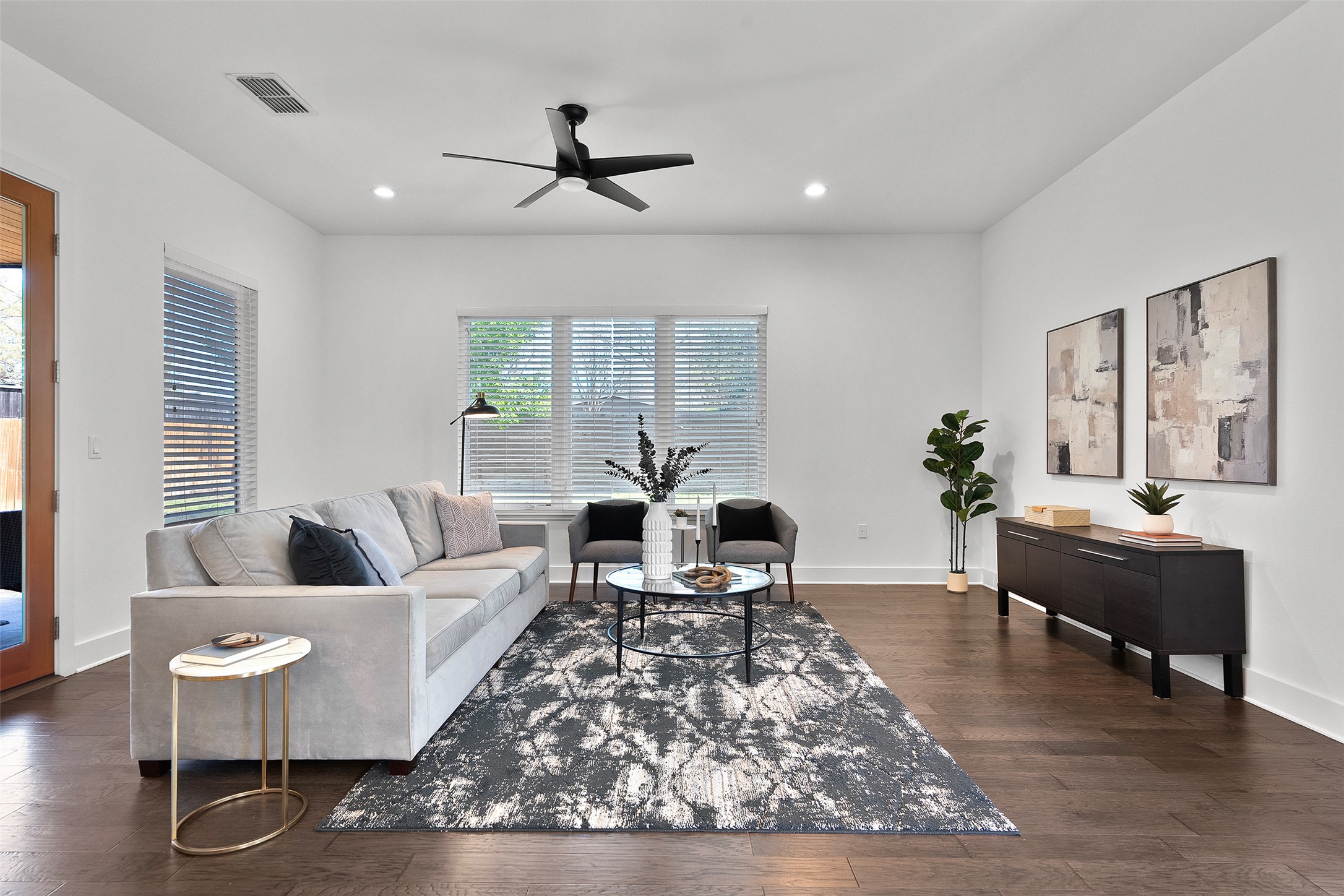 7813 Mullen Drive, Unit B Austin, TX 78757 - Photo 10 of 36 a living room with furniture or couch and a large window