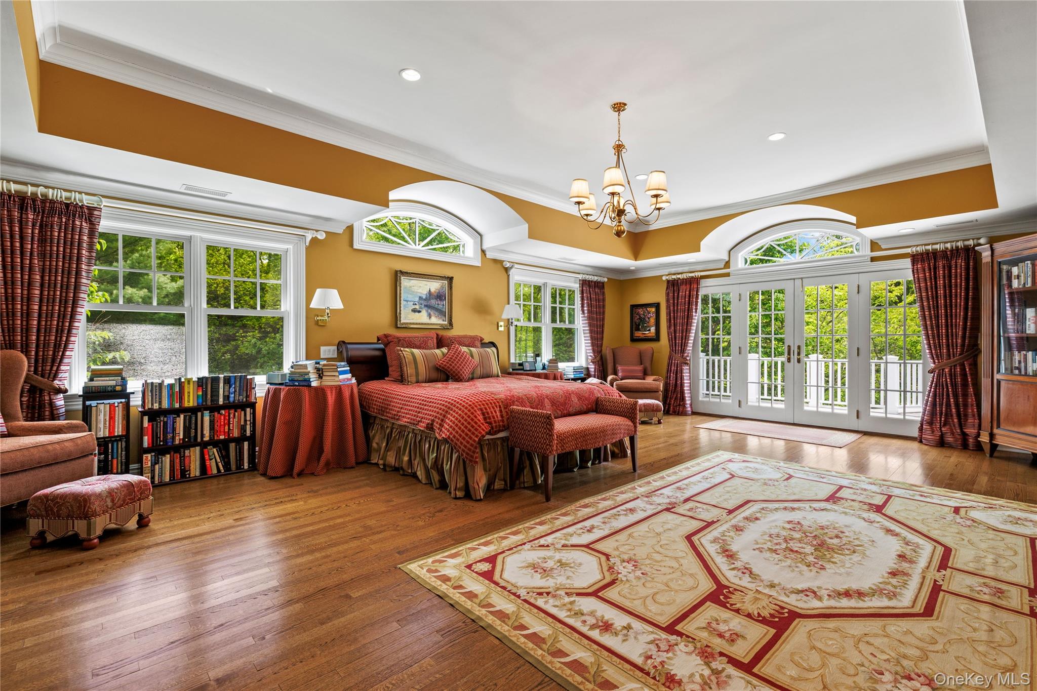 63 Old Mill River Road Pound Ridge, NY 10576 - Photo 27 of 47 a spacious bedroom with a bed and a large window