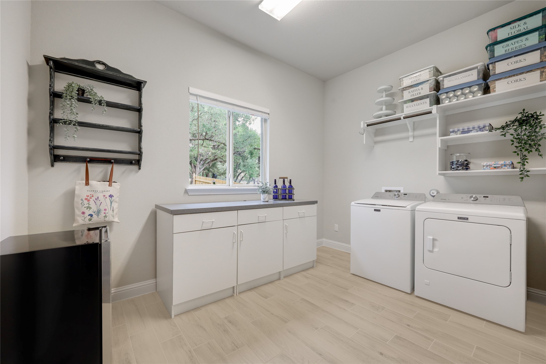 7425 Pace Ravine Drive Lago Vista, TX 78645 - Photo 28 of 40 Huge laundry room has a beautiful view of the garden area.