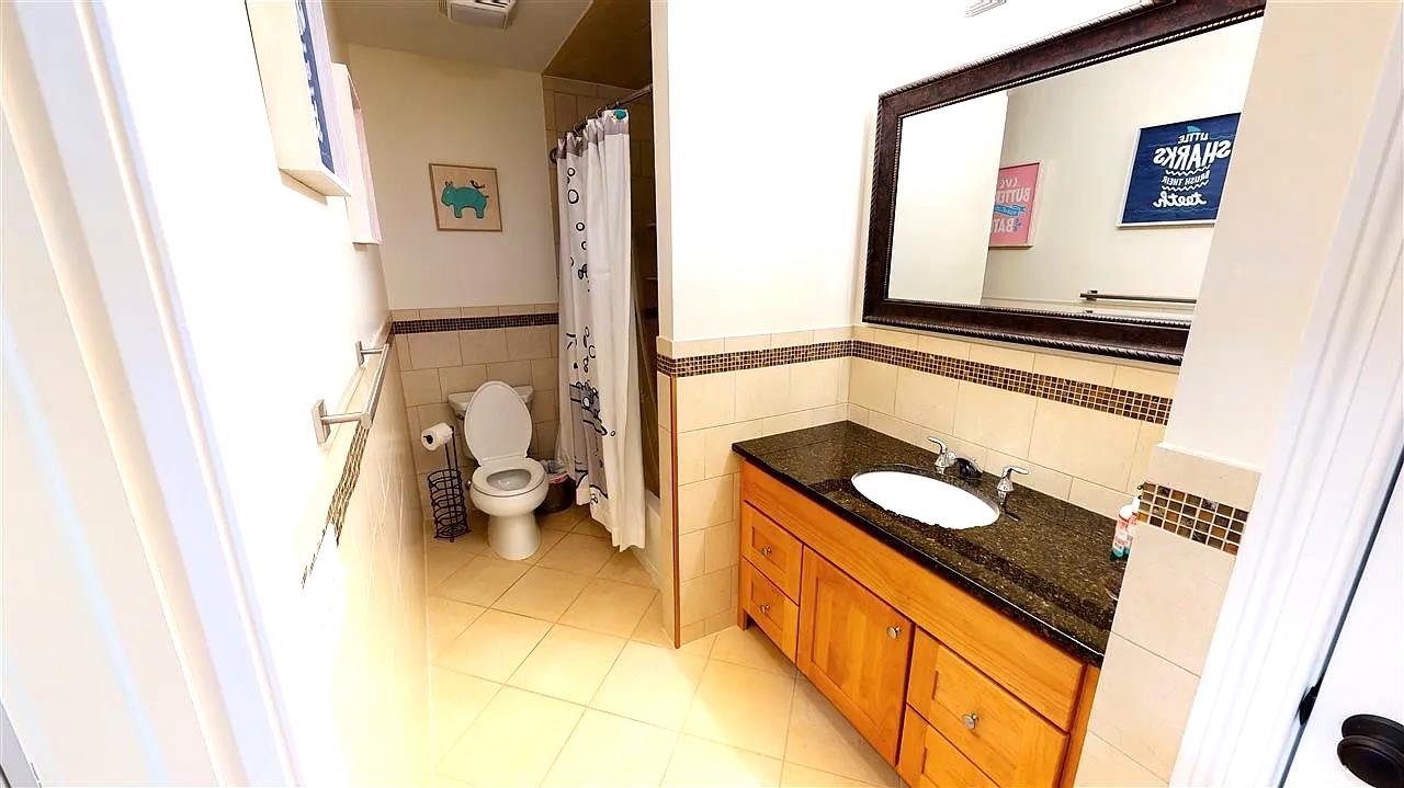 21 Jacob's Landing Way, Unit 21 Secaucus, NJ 07094 - Photo 15 of 19 a bathroom with a sink and a mirror