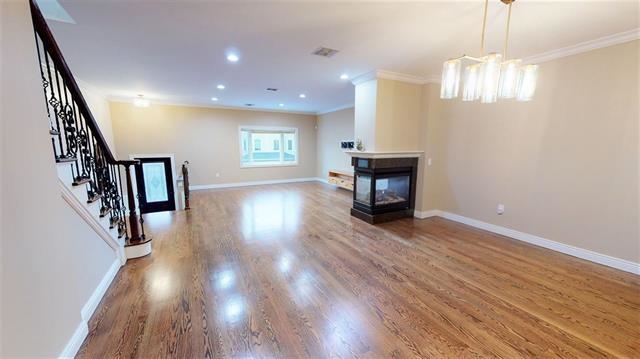 21 Jacob's Landing Way, Unit 21 Secaucus, NJ 07094 - Photo 2 of 19 wooden floor in an empty room with a window