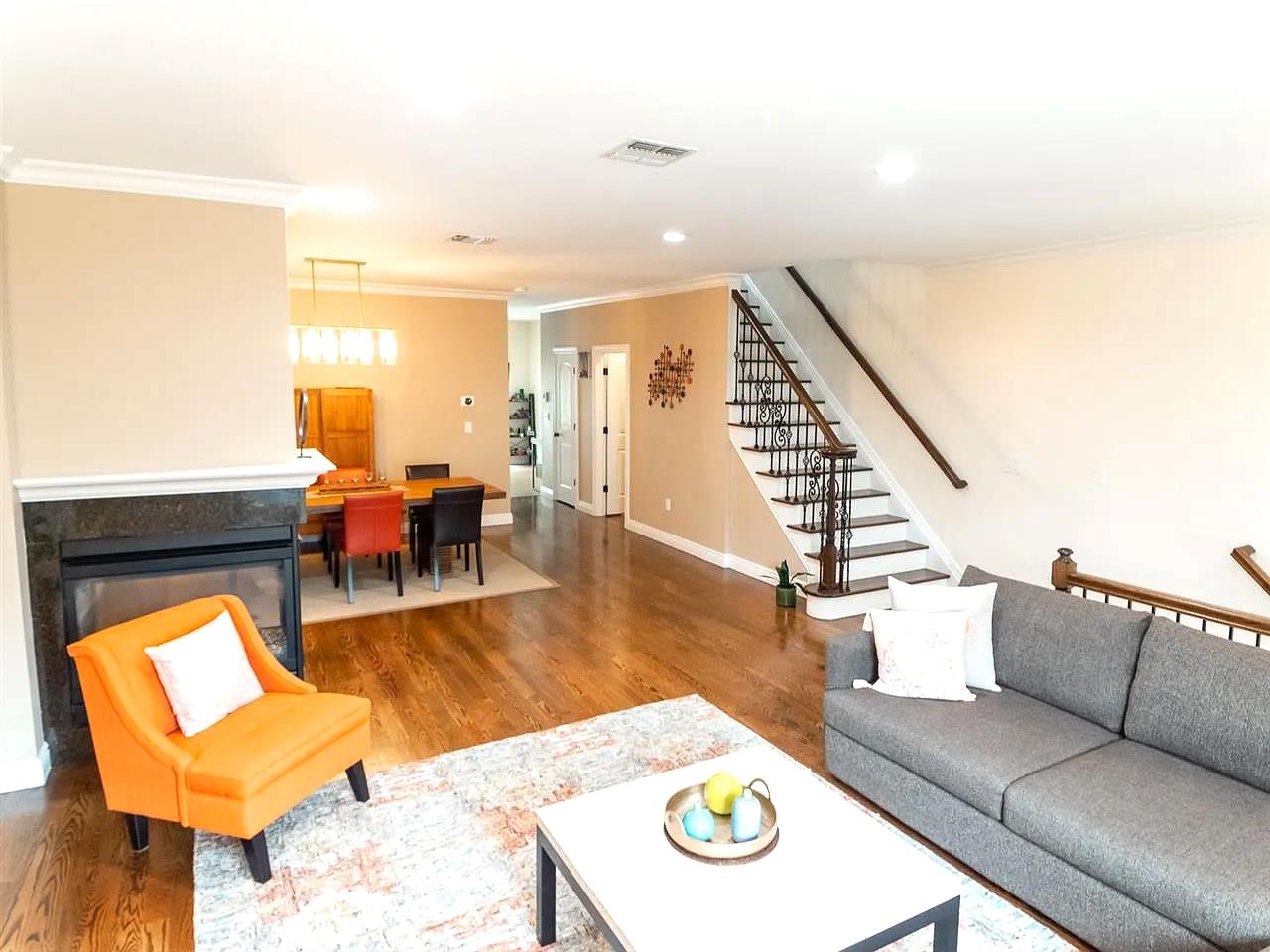 21 Jacob's Landing Way, Unit 21 Secaucus, NJ 07094 - Photo 3 of 19 a living room with furniture and wooden floor
