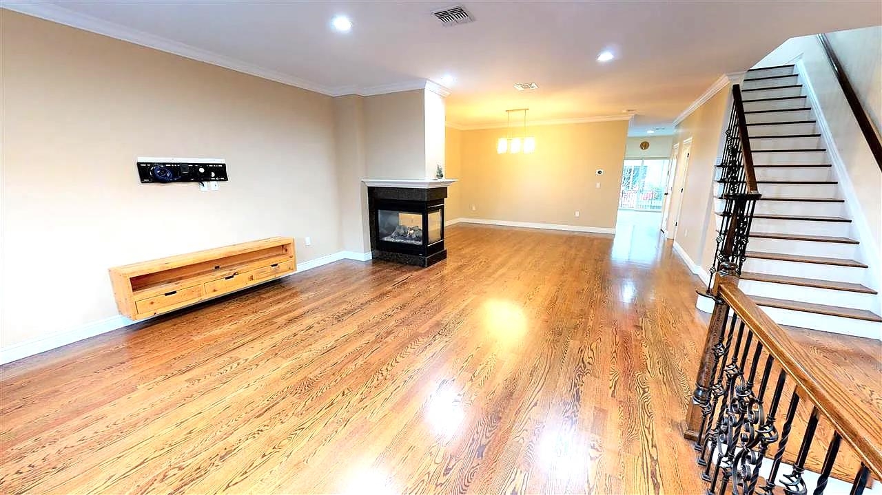 21 Jacob's Landing Way, Unit 21 Secaucus, NJ 07094 - Photo 4 of 19 a hallway with a table and chairs