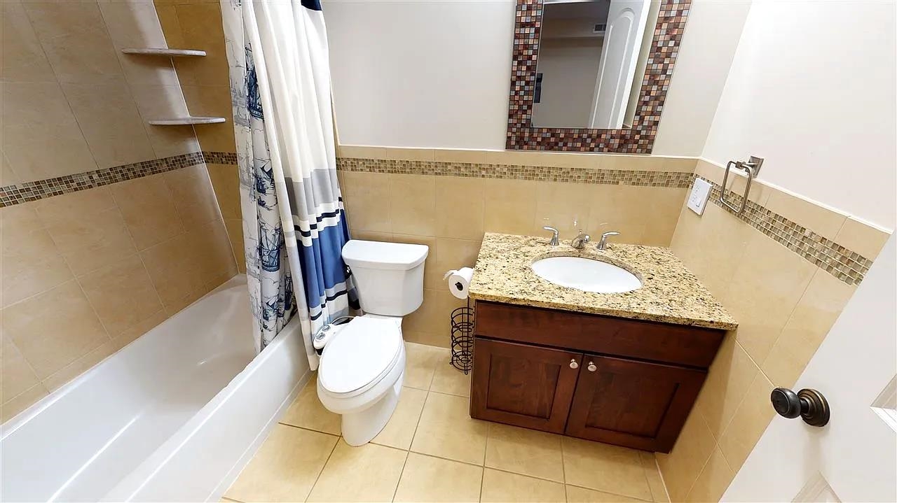 21 Jacob's Landing Way, Unit 21 Secaucus, NJ 07094 - Photo 10 of 19 a bathroom with a granite countertop sink and a mirror