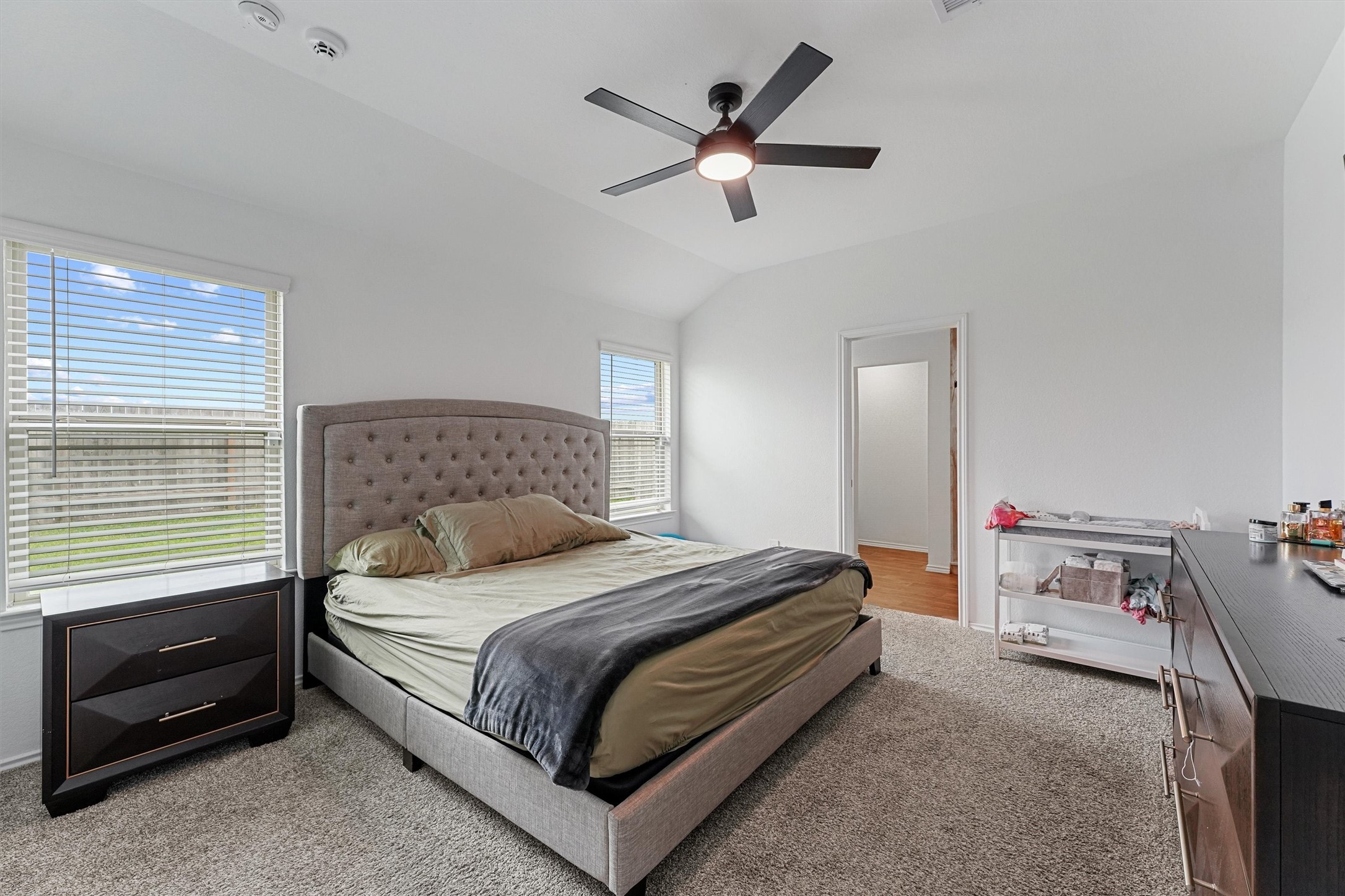 22411 Gilded Peak Lane Spring, TX 77373 - Photo 8 of 16 a bedroom with a bed and a ceiling fan