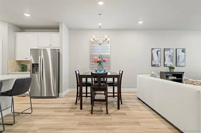 a view of a dining room with furniture and wooden floor