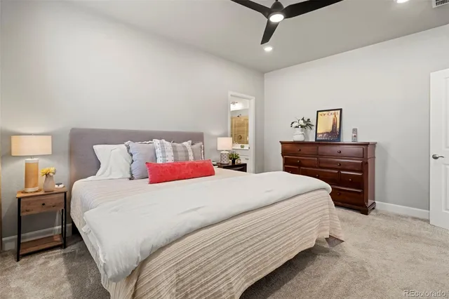 a bedroom with a bed and a dresser