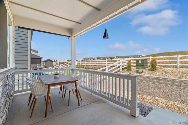 a view of balcony with furniture