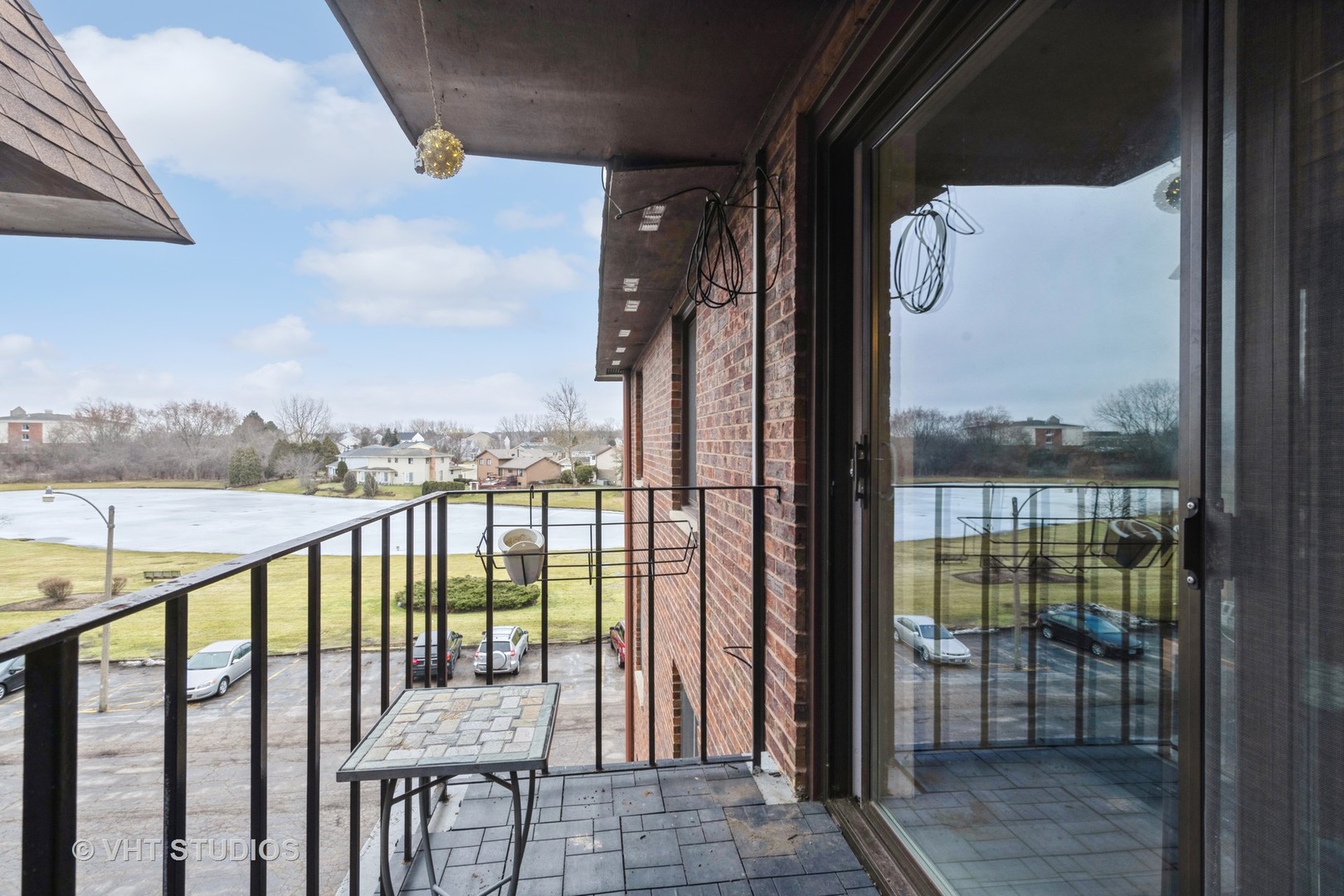 80 South Pleasant Road, Unit 304 Lake Zurich, IL 60047 - Photo 12 of 12 a view of a balcony with furniture
