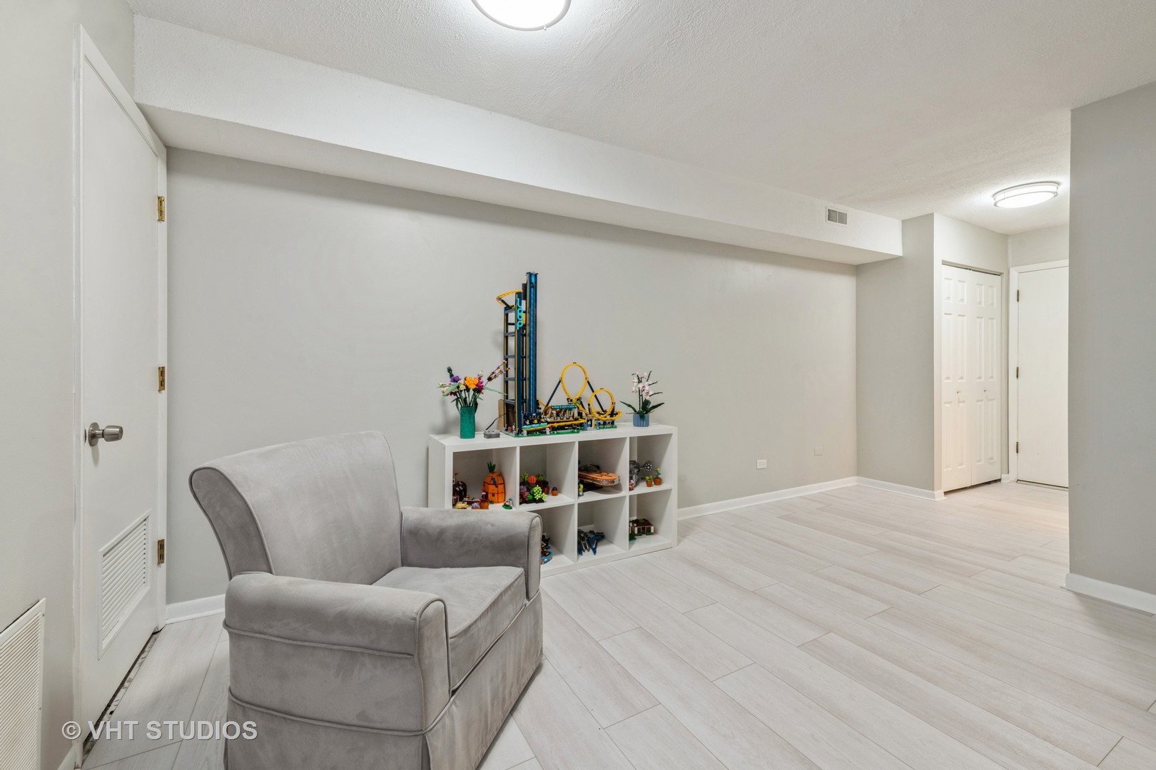 80 South Pleasant Road, Unit 304 Lake Zurich, IL 60047 - Photo 4 of 12 a room with furniture and a table