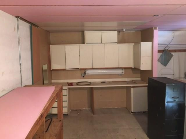 1771 Blount Road Pompano Beach, FL 33069 - Photo 2 of 7 a kitchen with a sink and cabinets