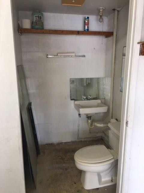 1771 Blount Road Pompano Beach, FL 33069 - Photo 5 of 7 a bathroom with a toilet and a sink