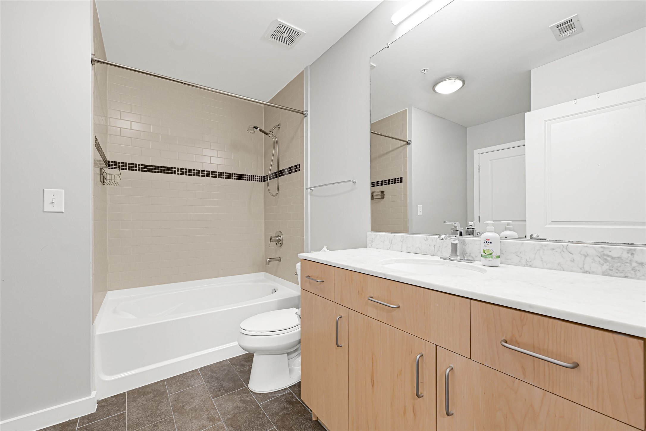 5925 Almeda Road, Unit 12403 Houston, TX 77004 - Photo 14 of 20 a bathroom with a granite countertop sink toilet tub and shower
