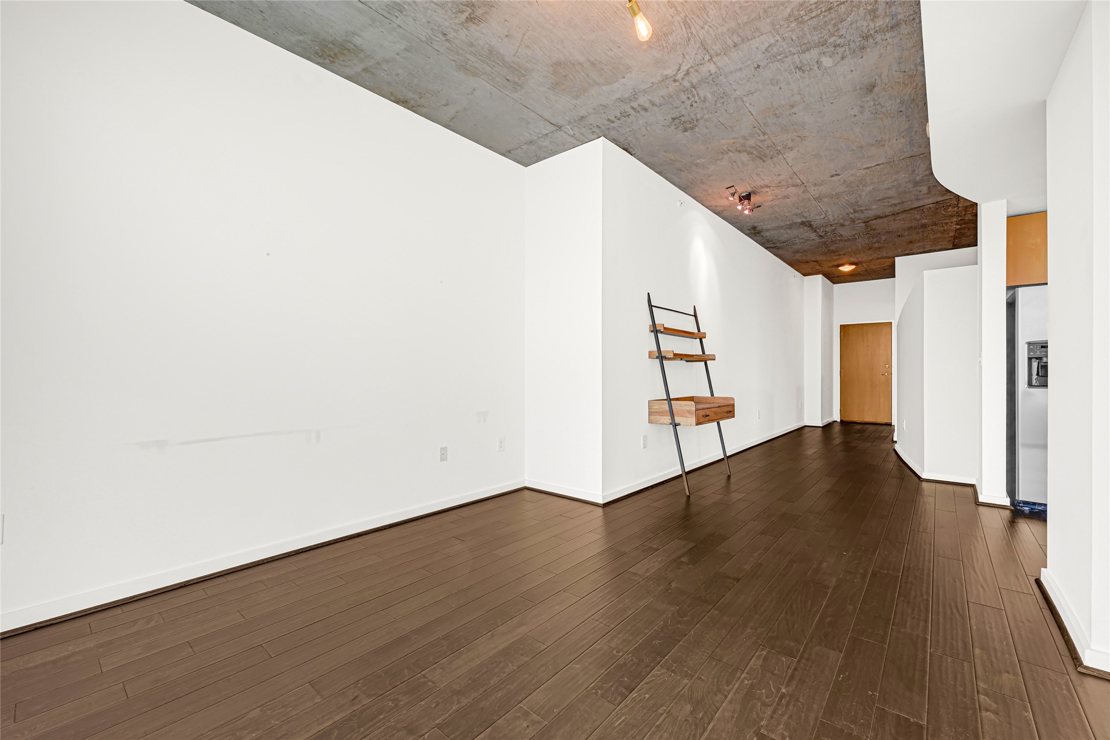 5925 Almeda Road, Unit 12403 Houston, TX 77004 - Photo 5 of 20 a view of a hallway with wooden floor and staircase