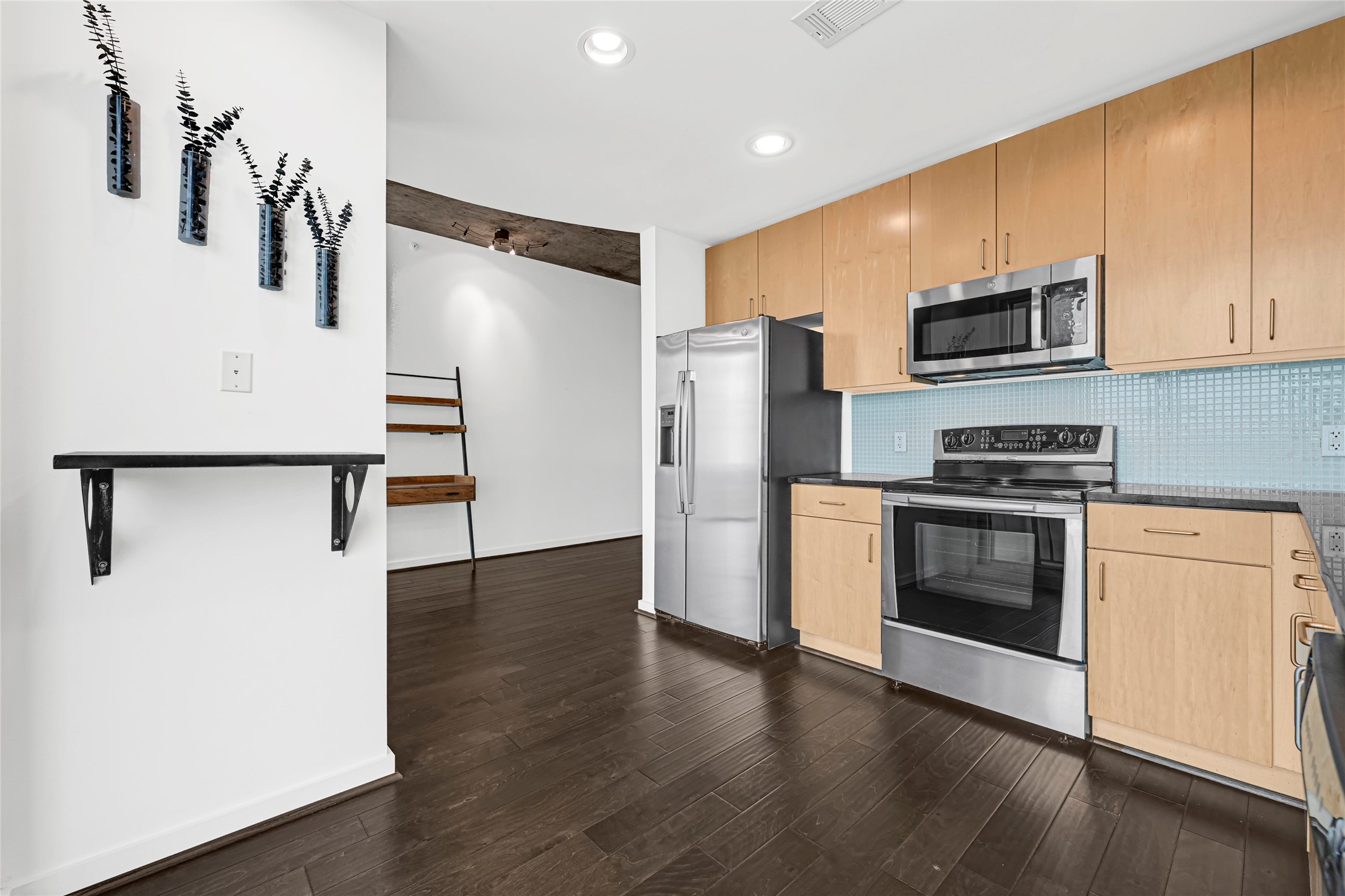 5925 Almeda Road, Unit 12403 Houston, TX 77004 - Photo 8 of 20 a kitchen with stainless steel appliances a refrigerator sink and microwave