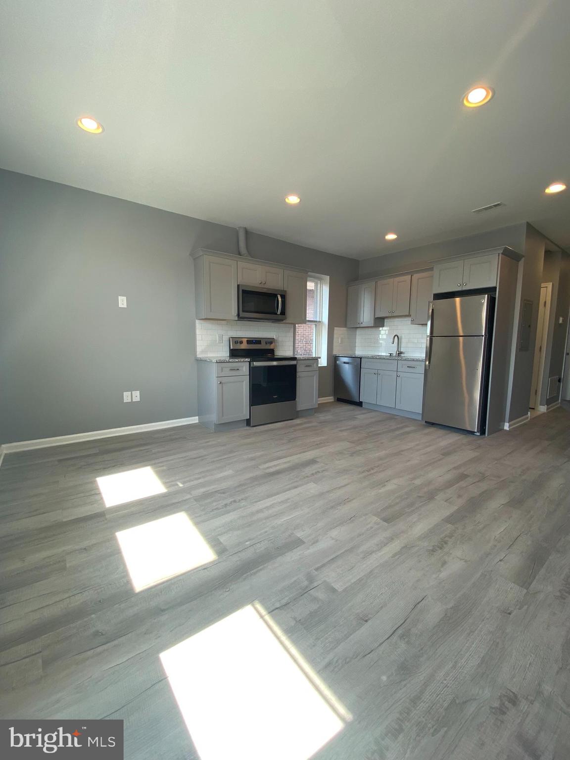 22 South 51st Street, Unit 3 Philadelphia, PA 19139 - Photo 3 of 12 a view of kitchen with stainless steel appliances cabinets