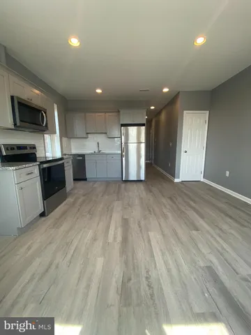 a view of a kitchen with a sink and a microwave