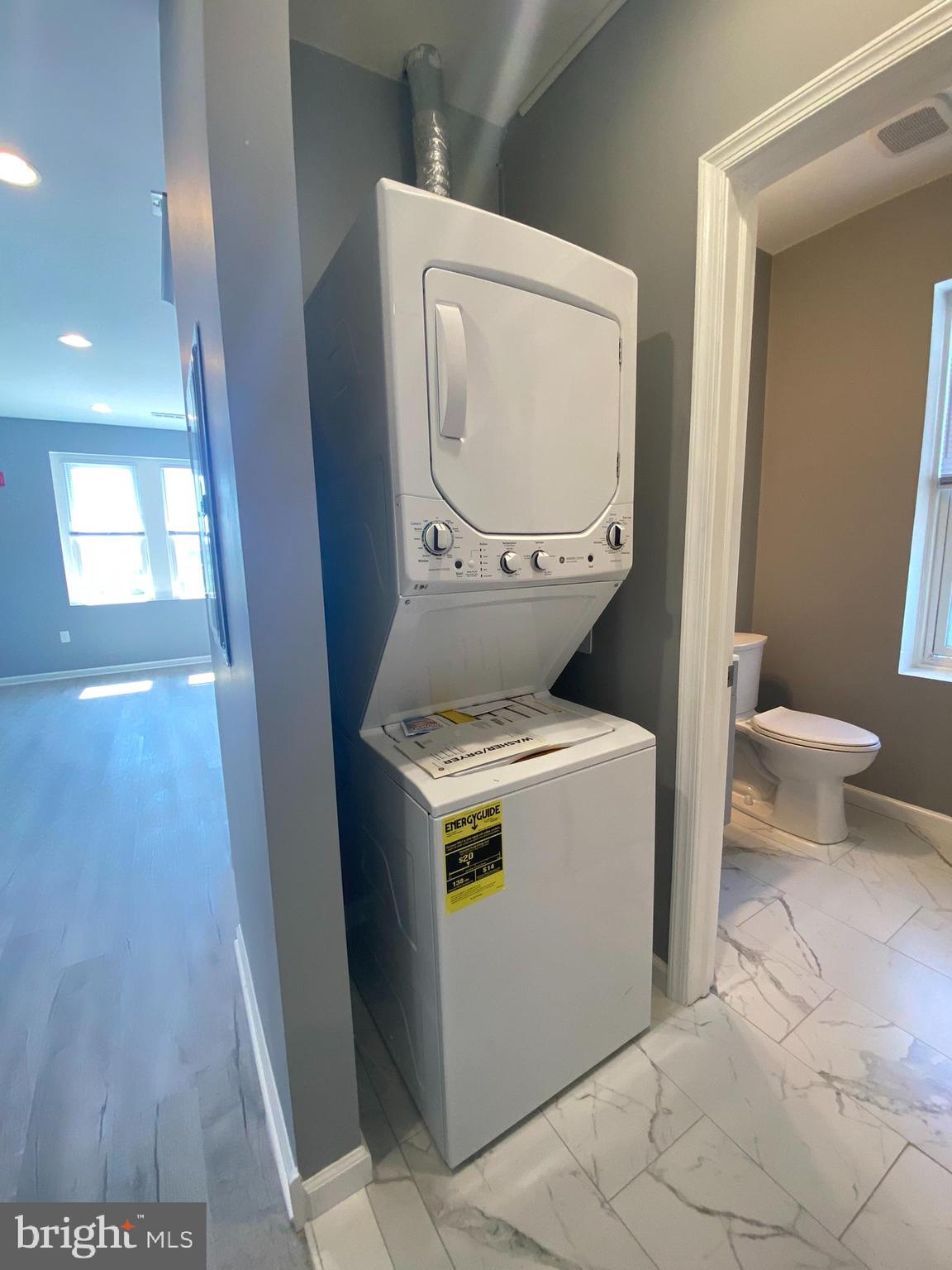 22 South 51st Street, Unit 3 Philadelphia, PA 19139 - Photo 9 of 12 a utility room with dryer and washer