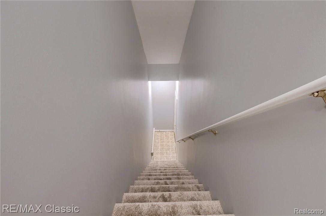 11822 Farmington Road, Unit 72 Livonia, MI 48150 - Photo 31 of 31 33-Stairway to Garage.jpg
