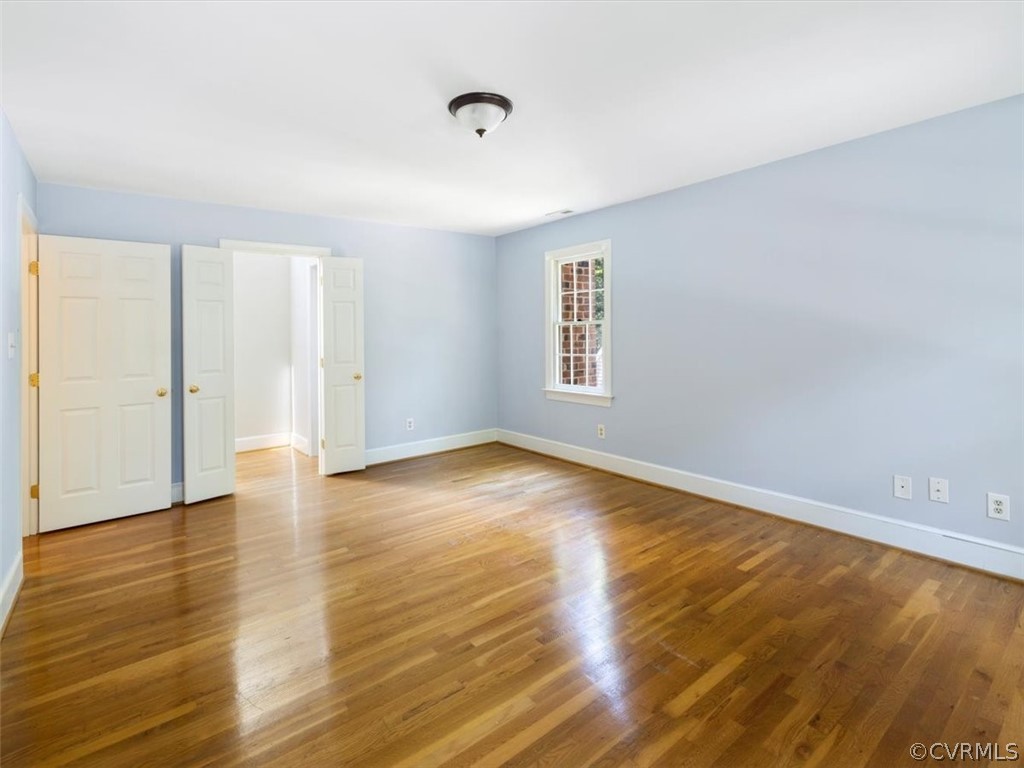 13807 Sunrise Bluff Road Midlothian, VA 23112 - Photo 26 of 40 a view of empty room with wooden floor and fan