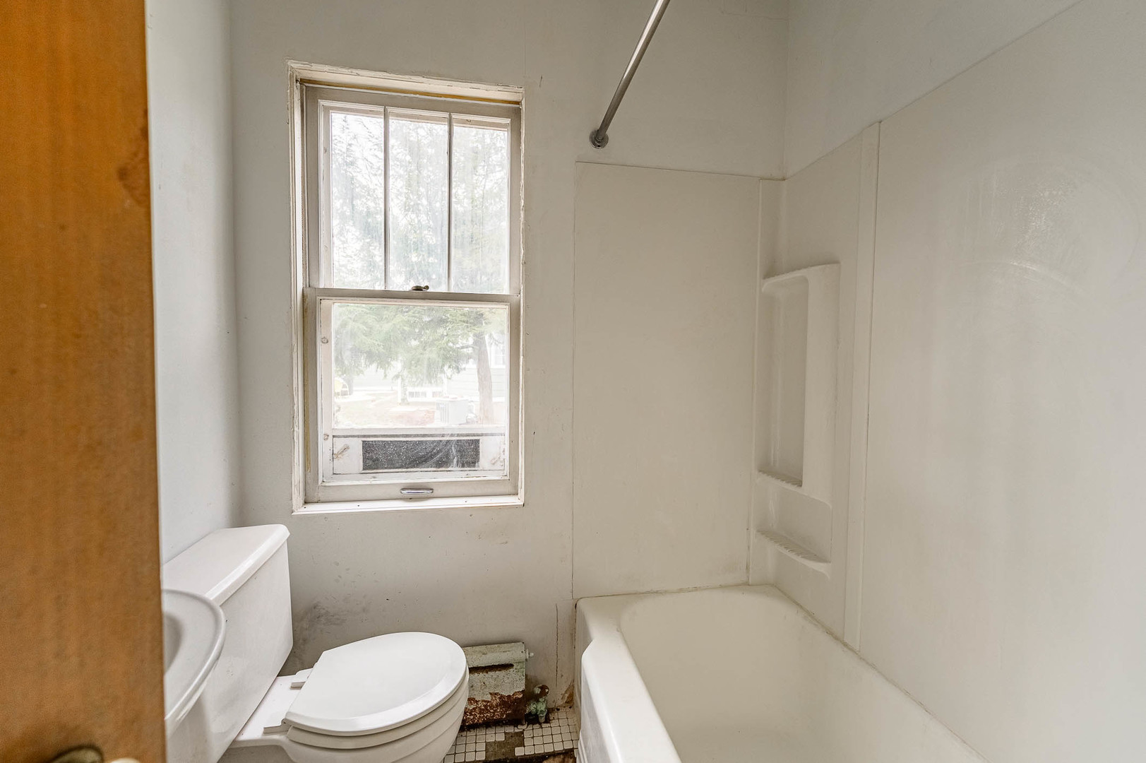 207 North Main Street Lombard, IL 60148 - Photo 12 of 15 a white toilet sitting next to a window