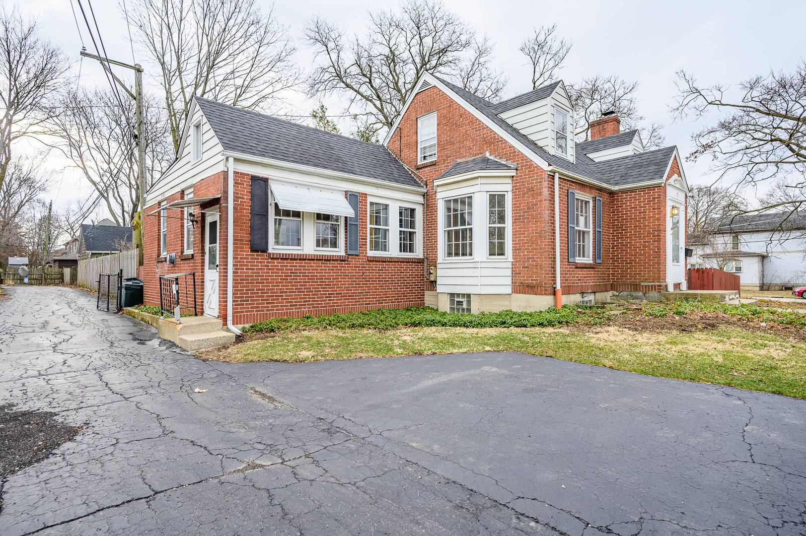 207 North Main Street Lombard, IL 60148 - Photo 2 of 15 a front view of a house with a yard and garage