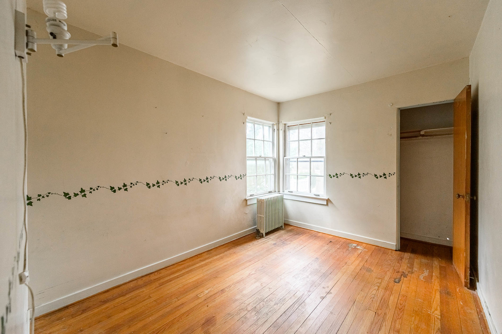 207 North Main Street Lombard, IL 60148 - Photo 4 of 15 a view of an empty room with wooden floor and a window